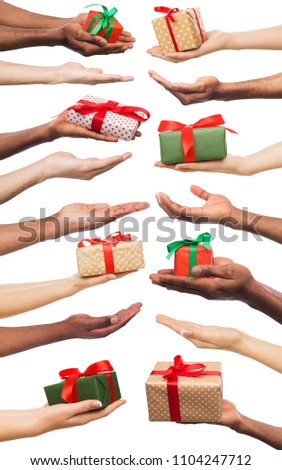 Set of white and african-american male and female hands holding present boxes for christmas, new year or birthday. Isolated at white background