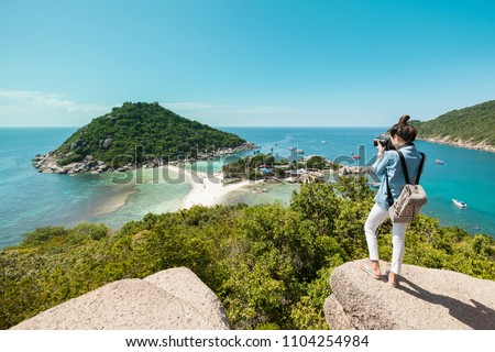 Girl traveller take a photo on top of hill, view point of Koh Tao,  Koh Samui, Koh  Pangan, Thailand