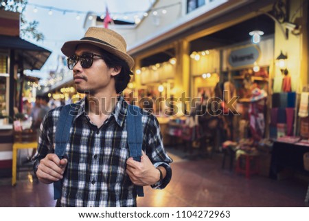 Asian man bag pack tourist in travelling at Thailand. 