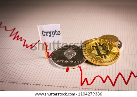 Financial bear market falling concept with physical bitcoin and ethereum over a red down chart and a flag with crypto word