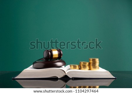 Stacking coins and book with financial concept.