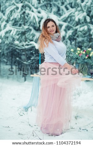 Girl on the background of a winter forest