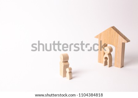 Parents share child in a divorce. The father takes the child from his mother. The child decides with which parent to live. The concept of a parent's choice, litigation. Father visits his son. Royalty-Free Stock Photo #1104384818