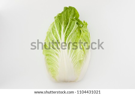 Napa cabbage or Chinese cabbage half, isolated white background