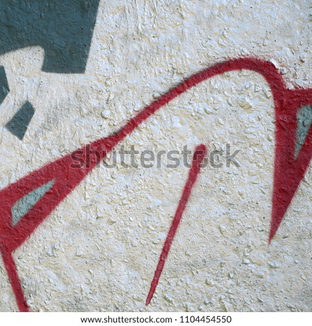 Street art. Abstract background image of a fragment of a colored graffiti painting in chrome and red tones