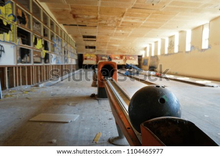 Bowling Ball in Ball Return at an Abandoned Bowling Alley