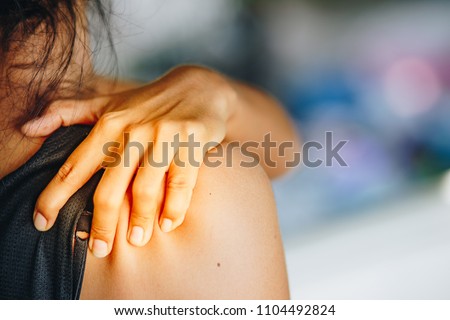 Young woman pain right shoulder,health care concept Royalty-Free Stock Photo #1104492824