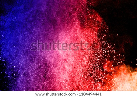 Multicolor powder explosion on black background. Paint Holi.Colored cloud. Colorful dust explode. 