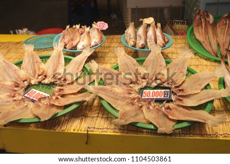 Dried fishes on display with price tag at Dongmun Traditional market in Jeju Island,South Korea. Royalty-Free Stock Photo #1104503861