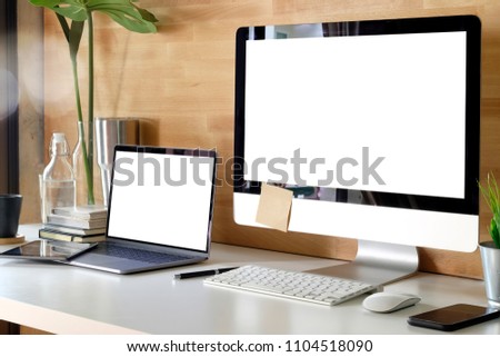 Mockup blank screen computer on desk.