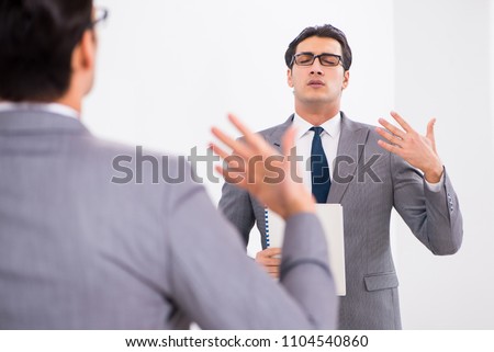 Politician planning speach in front of mirror Royalty-Free Stock Photo #1104540860
