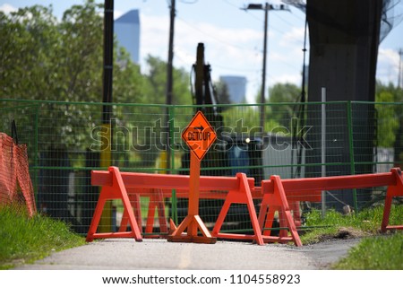 Bike path under construction with warning signs
