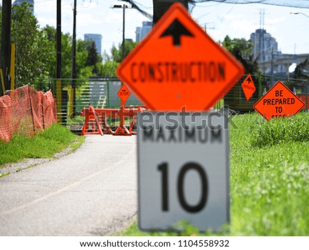 Bike path under construction with warning signs