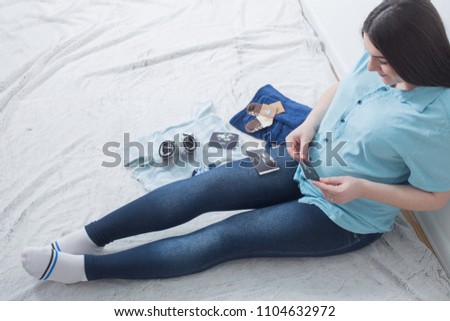 pregnant happy women on floor