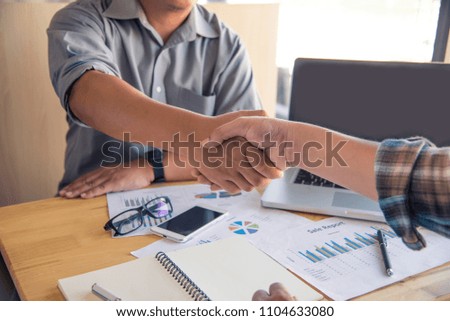 Handshake between joint venture businessman