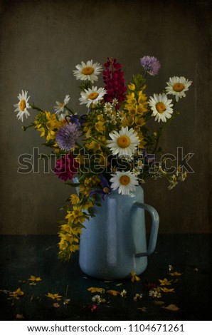 bouquet of summer flowers in a jug