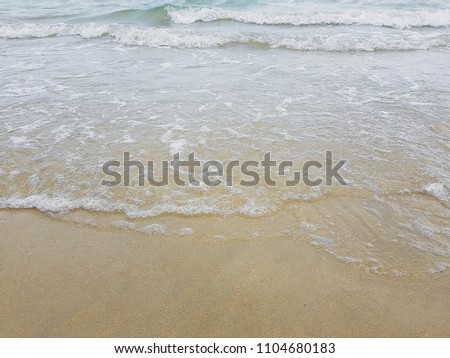 Sea waves on the sand