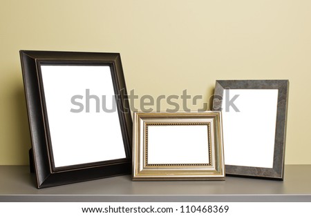 empty photo frames on old table