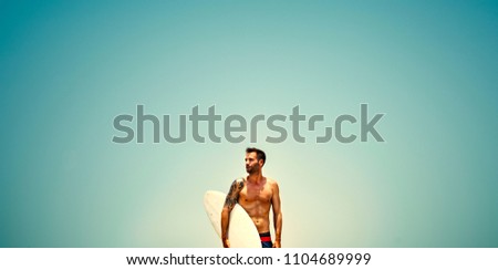 Fit man with a surf board