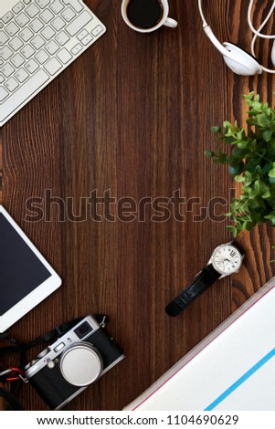 Directly above view of minimal flatlay with retro photo camera on wooden table, copy space