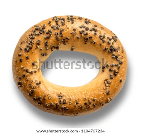A closeup of a bagel with a poppy.Traditional snack in Europe.Isolated photo on the white background for the site about the kitchen, food, traditions.