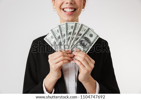 Cropped photo of young business woman holding money isolated over white wall backgound.