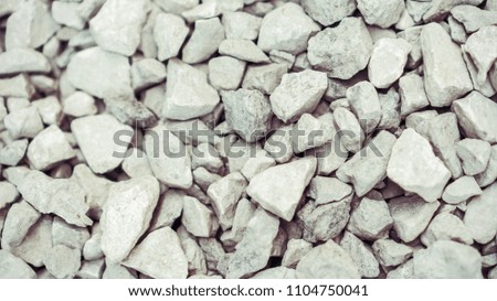 many small gray stone on ground for background texture