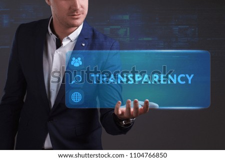 Business, Technology, Internet and network concept. Young businessman working on a virtual screen of the future and sees the inscription: Transparency