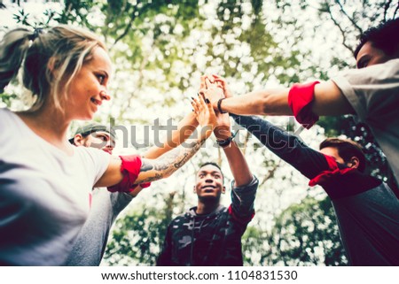 Outdoor teambuilding activity for a group of colleauges Royalty-Free Stock Photo #1104831530