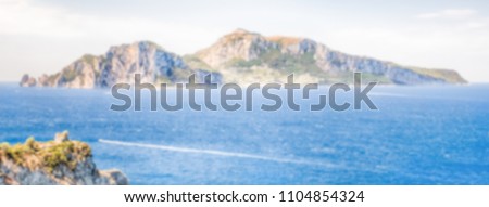 Defocused background with scenic aerial view of the Island of Capri, Italy, as seen from the town of Massa Lubrense. Intentionally blurred post production for bokeh effect