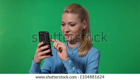 Happy Business Woman Browsing an Website Page Using Mobile Phone with Green Screen Background