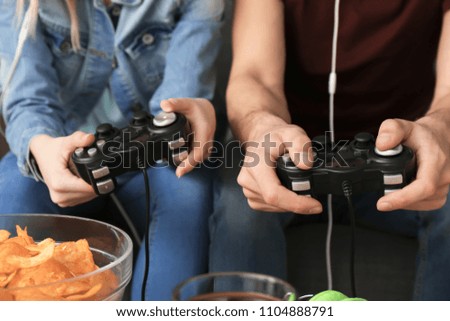 Young people playing video games, closeup