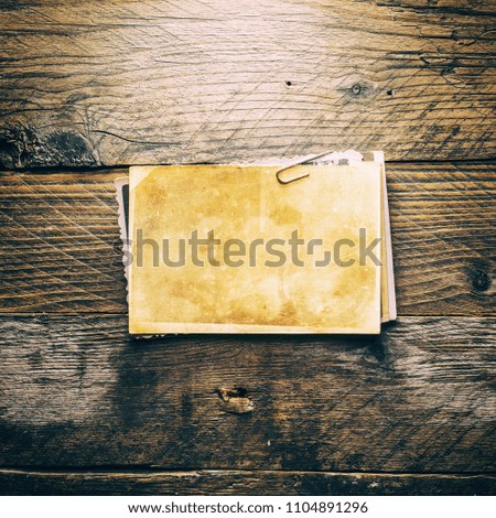 Vintage blank photo on a wooden background