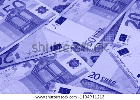 Euro money of different denominations duotone abstract background