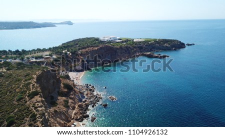 Aerial drone bird's eye view of famous clear water rocky beach of KAPE in area of Legrena, Sounio, Attica, Greece
