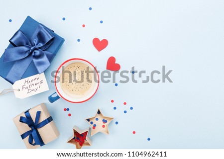 Holiday breakfast on Happy Fathers Day with coffee, gift or present  box and heart on table top view. Flat lay.