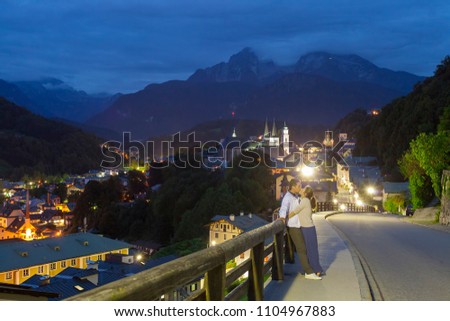 couple kissing at night in Berchtesgaden city, Germany Alps