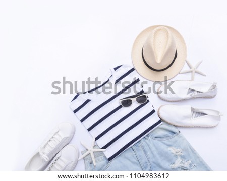 summer clothes on white,sunglasses,starfish,jeans , hat, shoes on flat lay, top view
