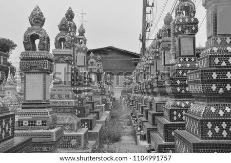 Black and white picture this is Thai temple has a pagoda to keep ancestral bones.Pagoda make by tile.