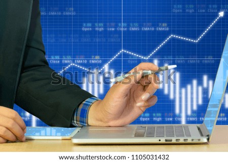 Businessman on digital stock market financial candlestick indicator background. Double exposure of growth graph futuristic economic currency chart investor analysis technology money exchange concept