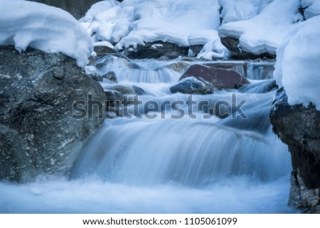 River in winter landscape long exposure. Long exposure shot of river. Royalty-Free Stock Photo #1105061099