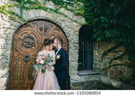 Happy bride and groom with bouquet