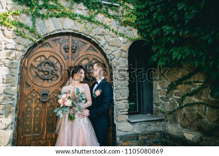 Happy bride and groom with bouquet