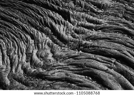 molten cooled down lava waves covering the ground surface