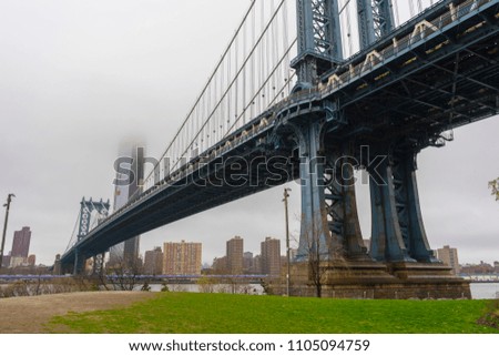 Manhattan Bridge and Manhattan skyline on gloomy day