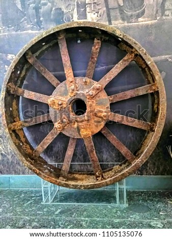 Photo of the old wheel from the American tractor "John Deere". Retro technique.