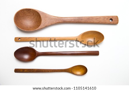 empty Spoons of different sizes with copy space. four wooden spoons on white background for text.
 Royalty-Free Stock Photo #1105141610