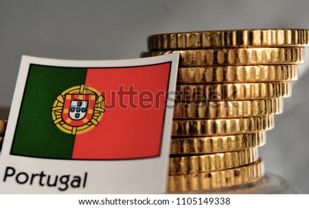 Piles of coins with flag of Portugal - economy