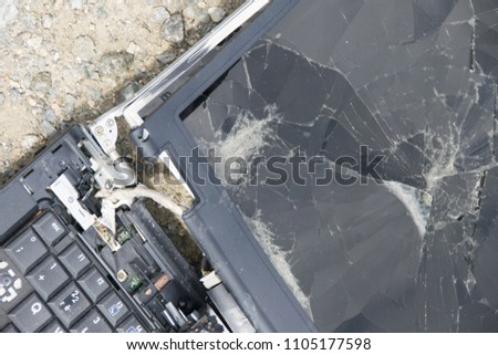 broken laptop disassembled into parts