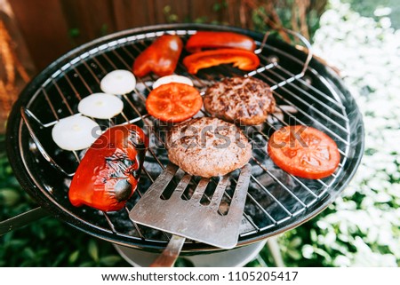 ingredients for burger are grilled
